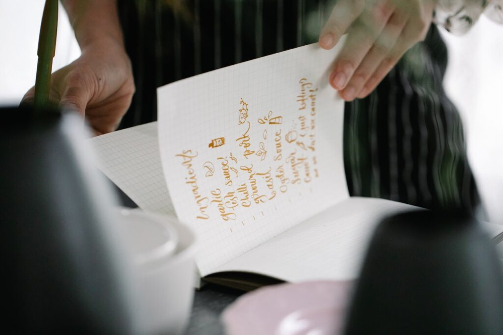 A home cook pouring over an ingredients list